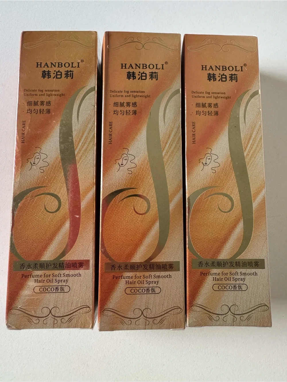Amazon HANBOLI Hair Oil Serum 3 Spray Boxes in Gold and Brown